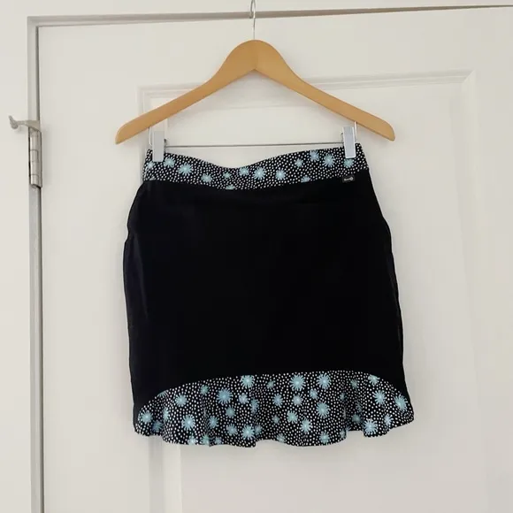Belyn Key Onyx Moonstruck Floral Ruffle Golf Skort UPF 50