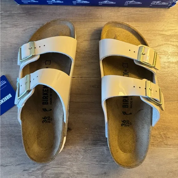 Birkenstock Arizona Gold Buckle High Shine Sandal in Sand Color
