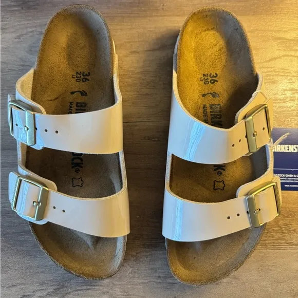 Birkenstock Arizona Gold Buckle High Shine Sandal in Sand Color