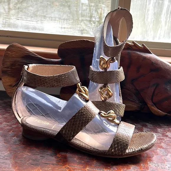 Fendi Snakeskin Flats with ankle strap, metal embellishments and vibram soles