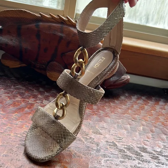 Fendi Snakeskin Flats with ankle strap, metal embellishments and vibram soles