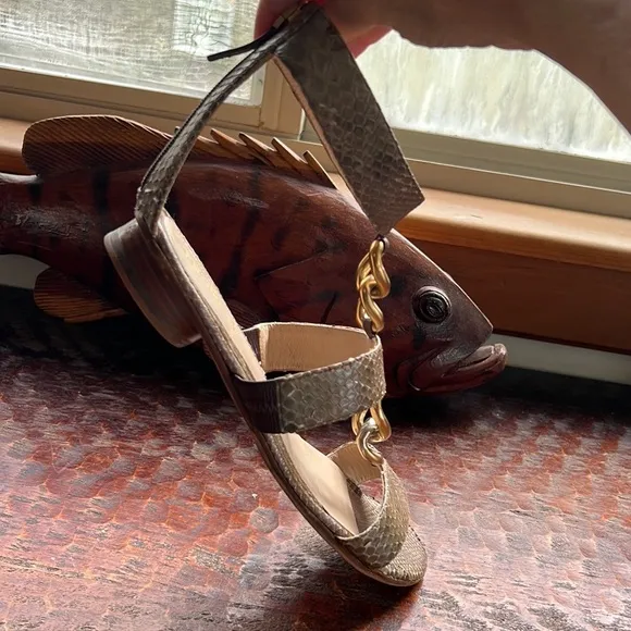 Fendi Snakeskin Flats with ankle strap, metal embellishments and vibram soles