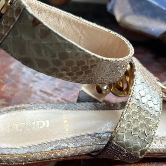 Fendi Snakeskin Flats with ankle strap, metal embellishments and vibram soles