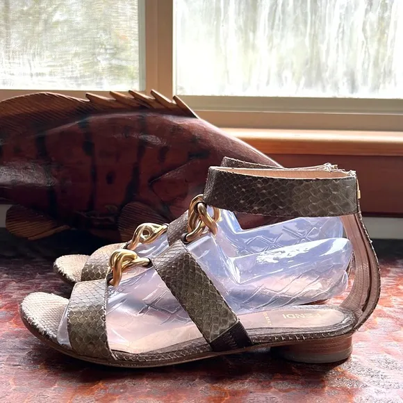 Fendi Snakeskin Flats with ankle strap, metal embellishments and vibram soles