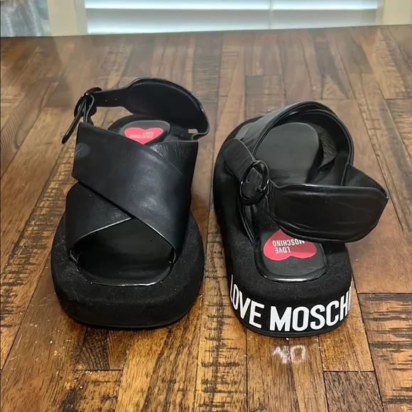 Love Moschino Sandals Black leather crossover pattern with buckle closure sz 38