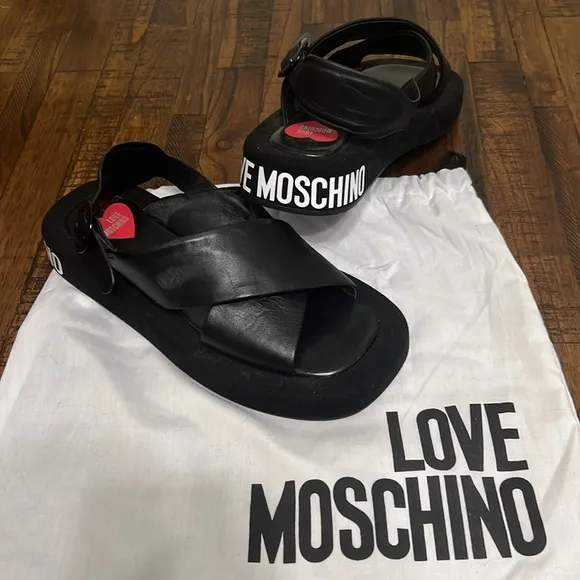 Love Moschino Sandals Black leather crossover pattern with buckle closure sz 38
