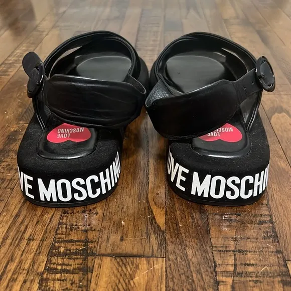 Love Moschino Sandals Black leather crossover pattern with buckle closure sz 38