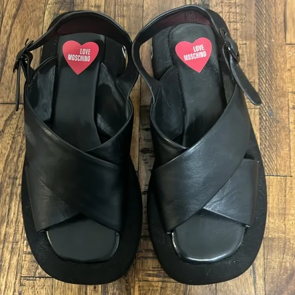 Love Moschino Sandals Black leather crossover pattern with buckle closure sz 38