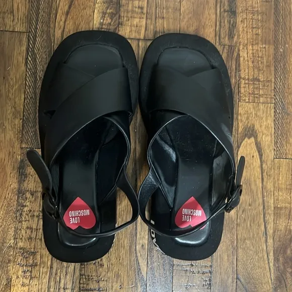 Love Moschino Sandals Black leather crossover pattern with buckle closure sz 38