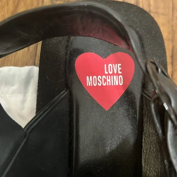 Love Moschino Sandals Black leather crossover pattern with buckle closure sz 38