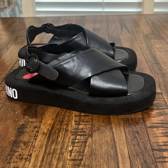 Love Moschino Sandals Black leather crossover pattern with buckle closure sz 38
