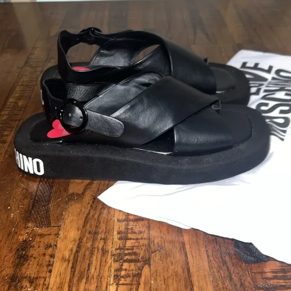Love Moschino Sandals Black leather crossover pattern with buckle closure sz 38
