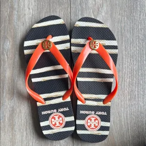 Tory Burch Black and Orange Sandals with Bold Design